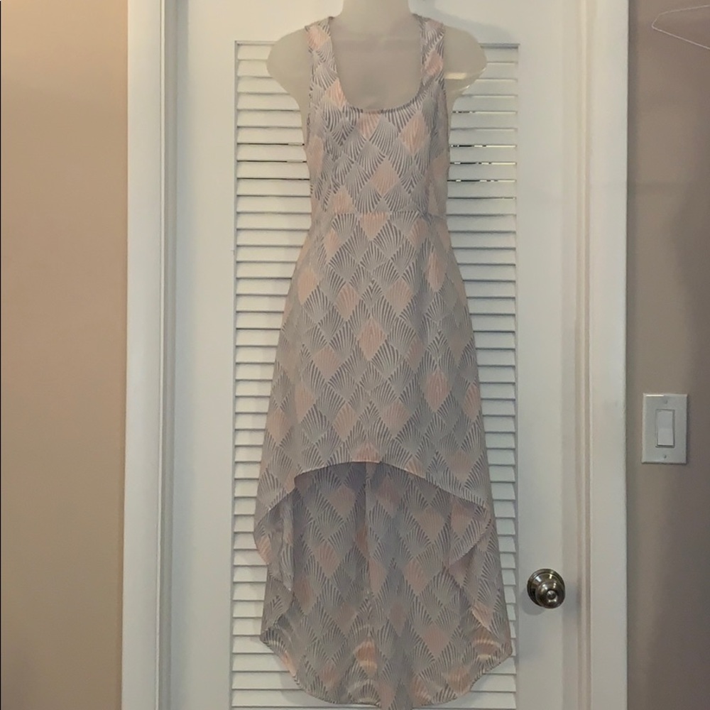 Millau | High low dress with lace up back | Pink & Purple fan print